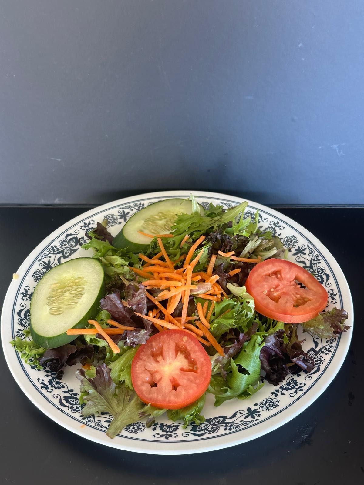 Fresh garden salad with tomato, cucumber and carrot