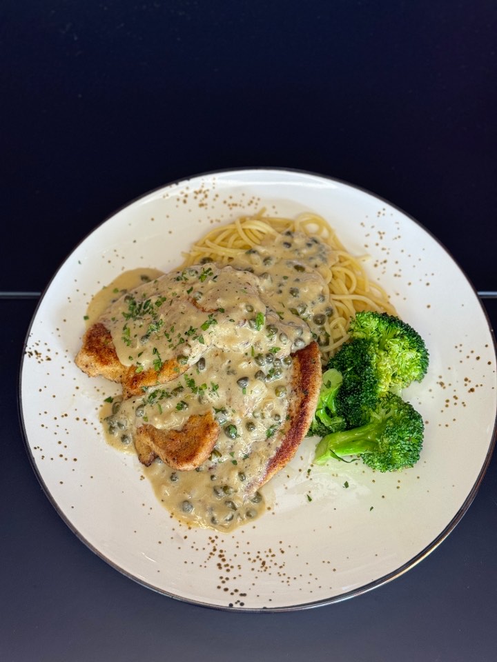 Chicken piccata with lemon-caper cream sauce over spaghetti and broccoli